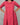 Red patterned dress worn by a person on a gray background