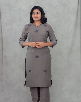 Gray dress with black palm tree patterns on a plain background