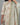 Light green traditional outfit with floral patterns on a gray background