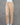 Beige cotton bottom on a mannequin against a gray background