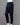 Black cotton pants on a mannequin against a gray background