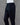 Black pants on a mannequin against a gray background