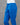 Blue pants on a mannequin against a gray background