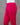 Bright pink pants on a mannequin against a gray background