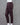 Deep brown pants on a mannequin against a gray background