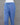 Blue cotton pants on a mannequin against a gray background