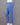 Blue cotton pants on a mannequin against a gray background