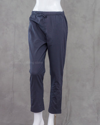 Grey pants on a mannequin against a gray background