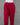 Red pants on a mannequin against a gray background