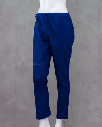 Navy blue cotton pants on a mannequin against a gray background