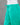 Turquoise cotton pants on a mannequin against a gray background