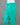 Turquoise cotton pants on a mannequin against a gray background