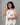 A women wearing printed white kurti on a grey background