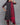 A women wearing printed black cotton kurti with plain bottom and printed maroon color dupatta on a grey background