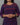 A women wearing a navy blue printed cotton kurti on a grey background