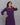 A women wearing a navy blue printed cotton kurti on a grey background