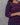 A women wearing a navy blue printed cotton kurti on a grey background