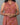 A women wearing a kalamkari printed pure cotton collored kurti on a grey background