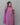 Woman wearing a purple floral patterned outfit with kota dupatta against a gray background