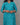 Woman wearing a blue floral dress against a gray background