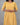 Yellow dress worn by a person on a gray background