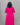 Person wearing a bright pink dress with a subtle pattern against a gray background