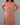 Person wearing a brown textured dress against a gray background