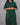 Women wearing a green checkered kurti in a gray background 