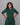 Women wearing a green checkered kurti in a gray background 
