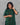 Women wearing a green checkered kurti in a gray background 