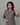 Gray dress with black palm tree embroidered patterns on a plain background