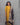 Woman wearing a yellow kurti with a kalamkari dupatta against a gray background