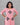 Woman wearing a pink kurta with black patterns on a gray background