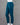 Dark teal pant on a mannequin against a gray background