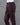 Deep brown cotton pants on a mannequin against a gray background