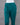 Teal green pants on a mannequin against a gray background