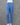 Denim blue cotton bottom on a mannequin against a gray background