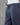 Grey pants on a mannequin against a gray background