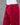 Red pants on a mannequin against a gray background
