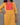 Yellow kurta with a red and orange checkered top on a gray background