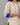 Beige kurta with blue accents on a plain background