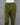 Olive green pants on a mannequin against a gray background