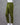 Olive green cotton pants on a mannequin against a gray background