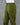 Olive green cotton pants on a mannequin against a gray background