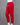 Red pants on a mannequin against a gray background