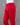 Red pants on a mannequin against a gray background