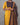 Person wearing a yellow and patterned outfit with a plain background