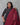 A women wearing printed black cotton kurti with plain bottom and printed maroon color dupatta on a grey background