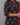 A women wearing printed black cotton kurti with plain bottom and printed maroon color dupatta on a grey background