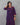 A women wearing a navy blue printed cotton kurti on a grey background